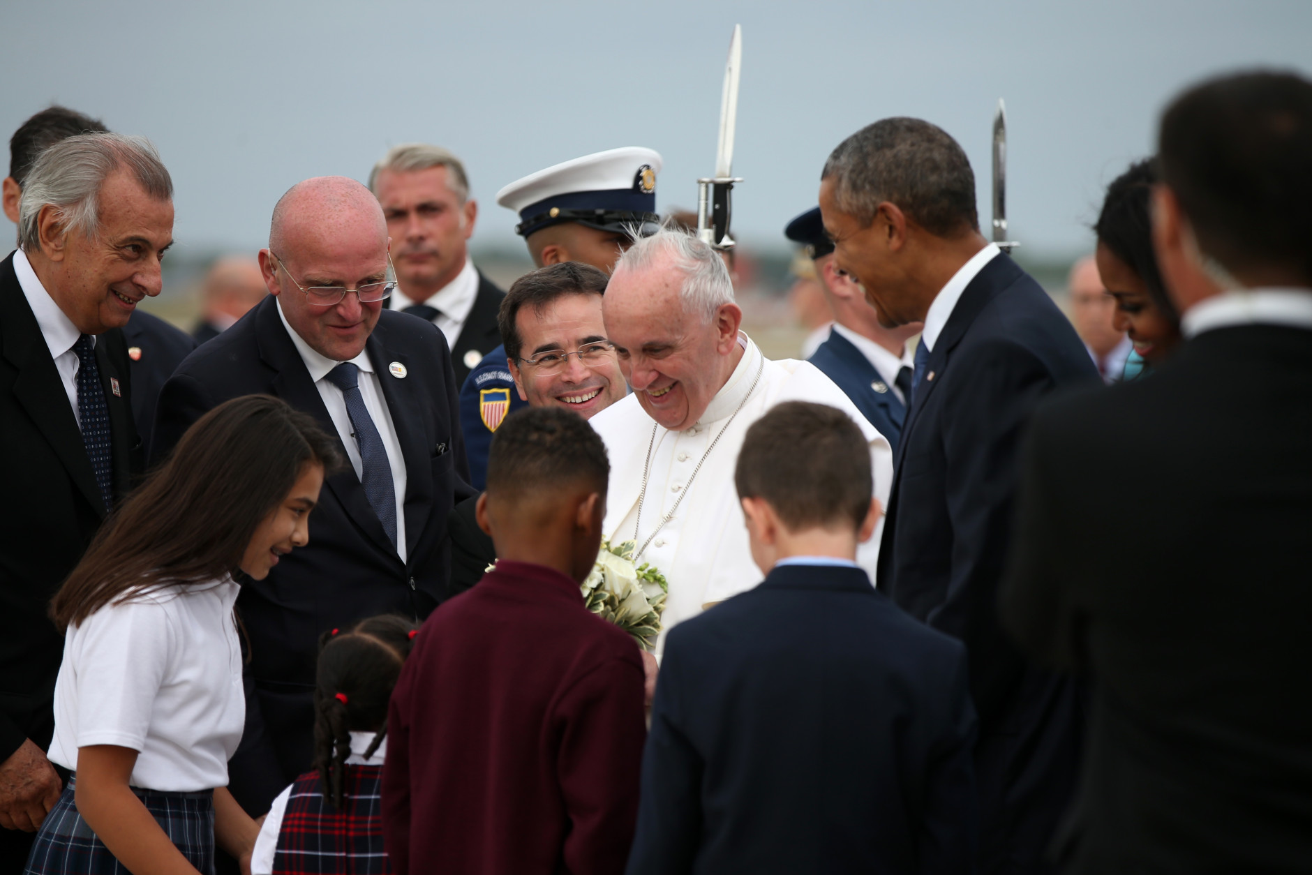 Pope Francis, accompanied by President Barack Obama, and others,  is greeted upon his arrival at Andrews Air Force Base, Md., Tuesday, Sept. 22, 2015. (AP Photo/Andrew Harnik)