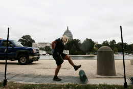 WASHINGTON, DC - SEPTEMBER 21: US Capitol grounds worker Lisa Gray unrolls crowd control fencing to be installed in preparation of Pope Francis' visit this week, September 21, 2015 in Washington, DC. Pope Francis will arrive in Washington on Tuesday to spend 3 days before he travels on to New York and Philadelphia. (Photo by Mark Wilson/Getty Images)