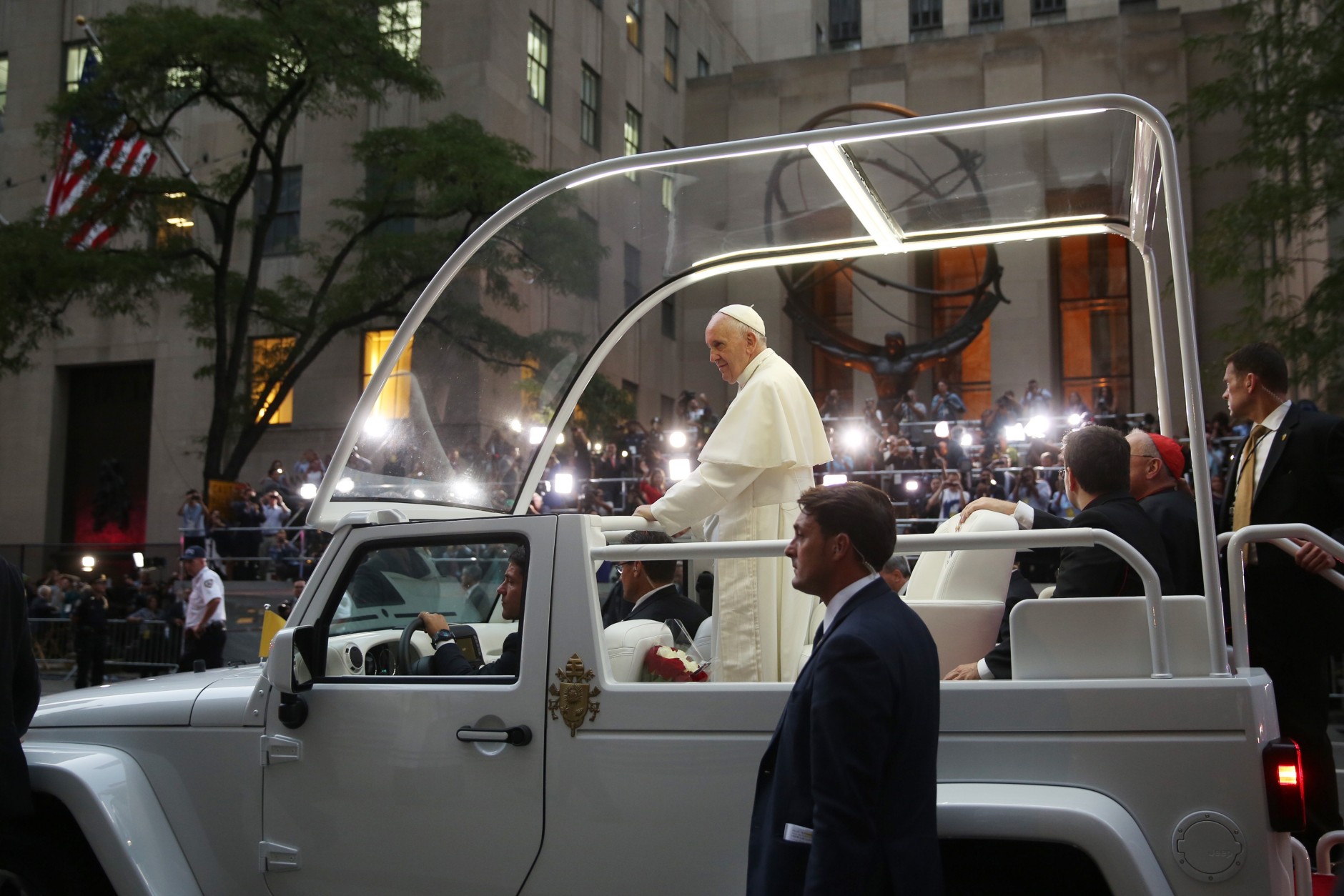 Pope Francis rides in the pope mobile on Fifth Avenue as he arrives at St. Patrick's Cathedral, Thursday, Sept. 24, 2015 in New York. (Damon Winter/The New York Times via AP, Pool)