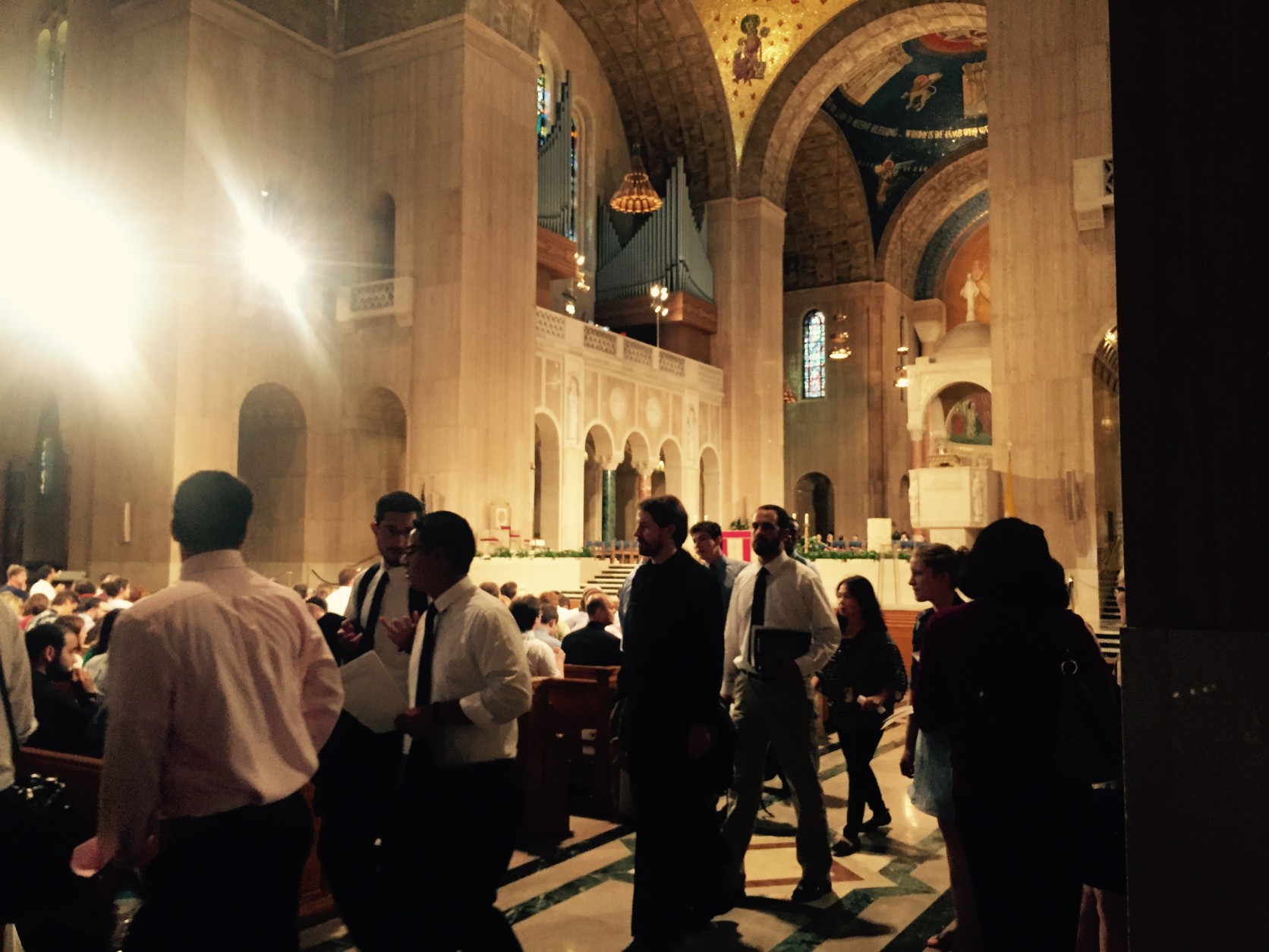 Students walk into mass at the Basillica Thursday. Many of the Catholic University students are excited for the pope's coming visit. (WTOP/Max Smith)