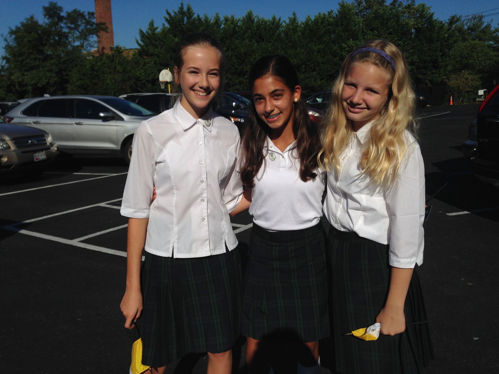 Sofia Warfield, 12, Isabella Khalef, 13, and another student are pictured here. (IWTOP/Jamie Forzato)