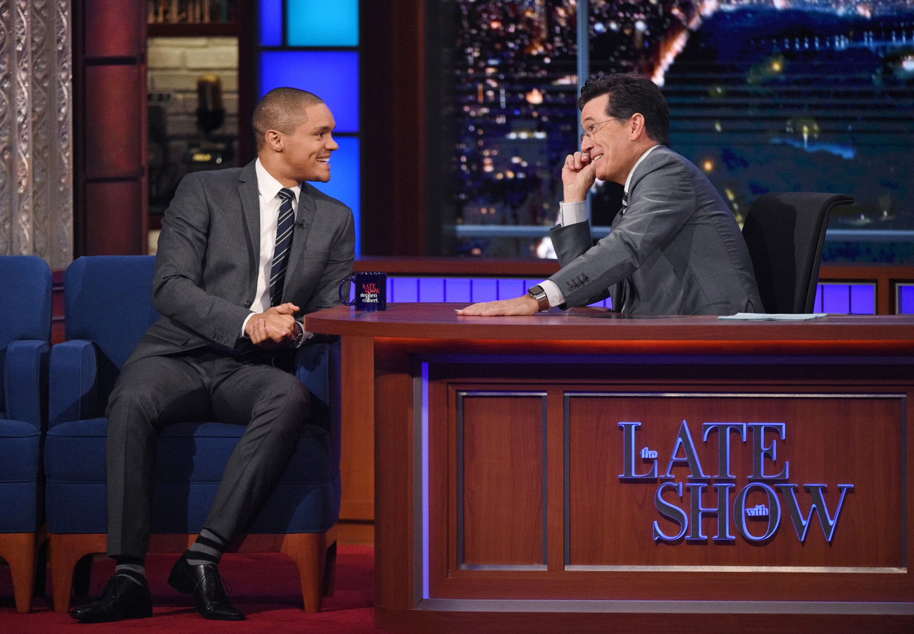 In this image released by CBS, Trevor Noah, left, of the "The Daily Show with Trevor Noah," left, appears with host Stephen Colbert during a taping of "The Late Show with Stephen Colbert," Thursday Sept. 17, 2015, in New York. (Jeffrey R. Staab/CBS via AP) MANDATORY CREDIT; NO ARCHIVE; NO SALES; FOR NORTH AMERICAN USE ONLY.