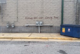 Anne Arundel County Police released this photo of vandalism to a wall at the Ritchie Highway Shopping Center. "Killing AAC Cops Coming Soon"  was spray-painted on two other walls at the shopping center. (Anne Arundel County Police Department)