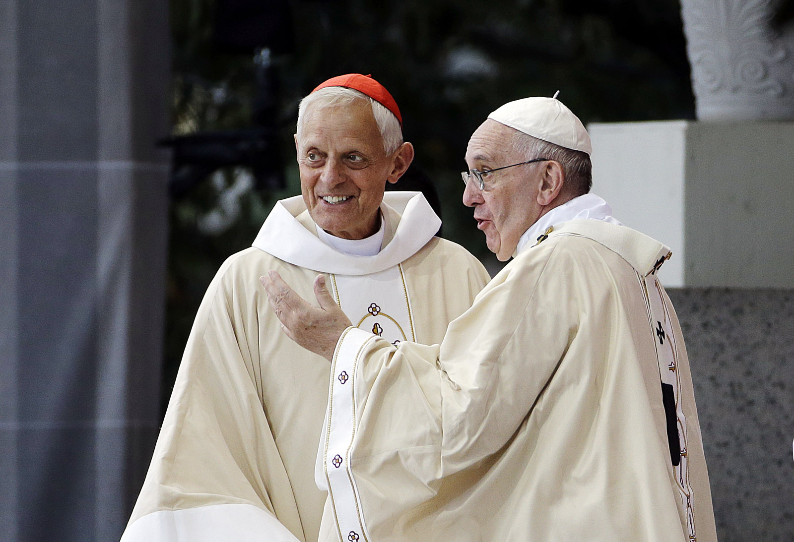 Cardinal Donald Wuerl, archbishop of Washington. left, looks toward the crowd with Pope Francis following a Mass outside the Basilica of the National Shrine of the Immaculate Conception Wednesday, Sept. 23, 2015, in Washington. (AP Photo/David Goldman)