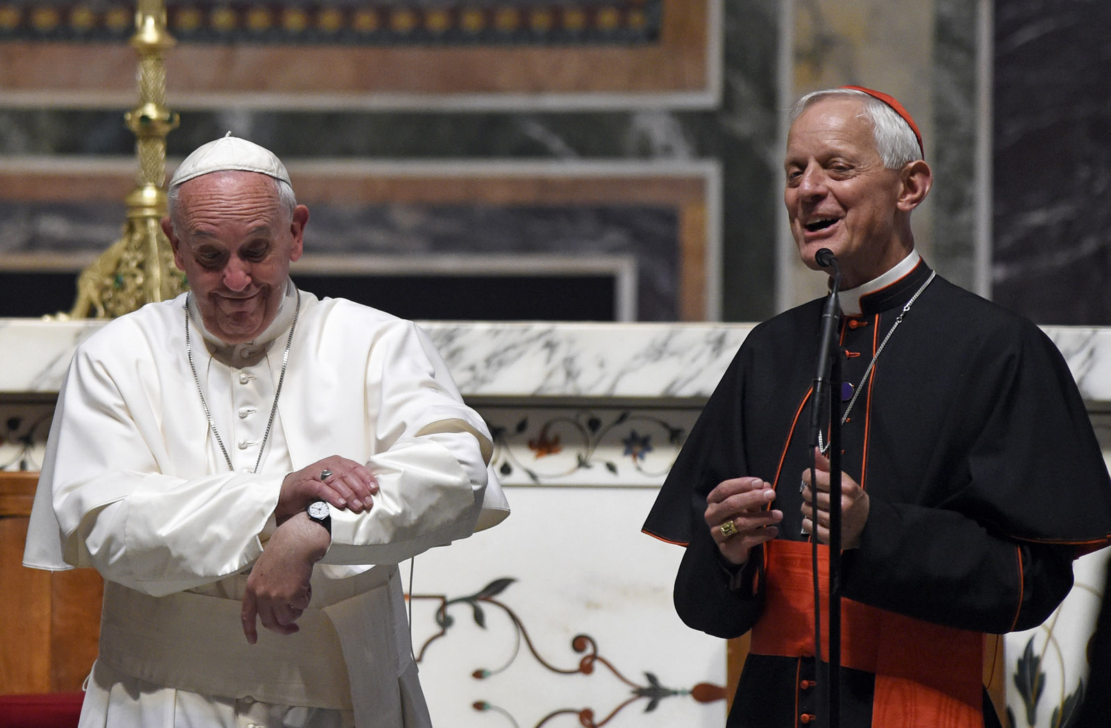 Cardinal Donald Wuerl, archbishop of Washington, right, translates for Pope Francis as the Pope wishes he had more time to greet everyone following the midday prayer from the Liturgy of Hours, the daily form of prayer of the Catholic Church, with bishops from the U.S., Wednesday, Sept. 23, 2015, at the Cathedral of St. Matthew the Apostle in Washington. (AP Photo/Susan Walsh)