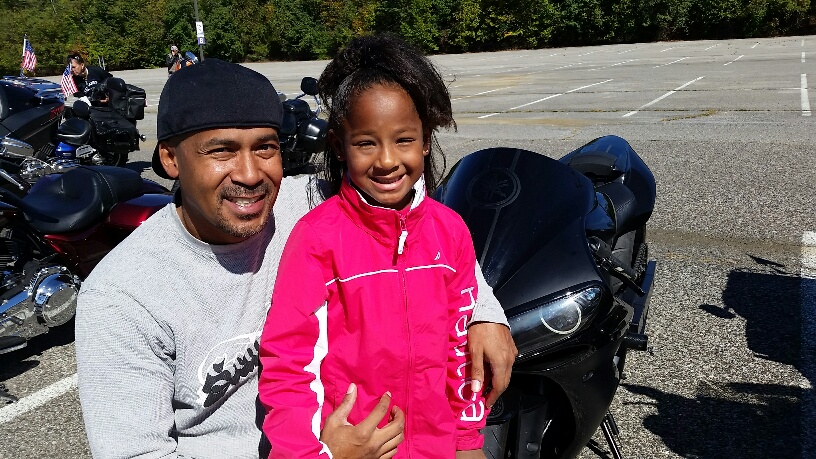 Nia Brittain, 7, was a born 12 weeks early. Her dad Leon Brittain  credited March of Dines with saving her life. He directed the March of Dimes Bikers for Babies event in Upper Marlboro, Md., on Saturday, Oct. 10, 2015. (WTOP/Kathy Stewart)