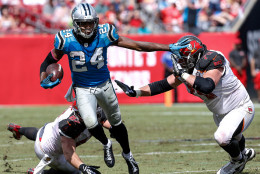 TAMPA, FL - OCTOBER 4: Cornerback Josh Norman #24 of the Carolina Panthers stiif arms Guard Logan Mankins #70 of the Tampa Bay Buccaneers on a run back from his second interception of the game at Raymond James Stadium on October 4, 2015 in Tampa, Florida. Panthers defeated the Buccaneers 37 to 23. (Photo by Don Juan Moore/Getty Images)