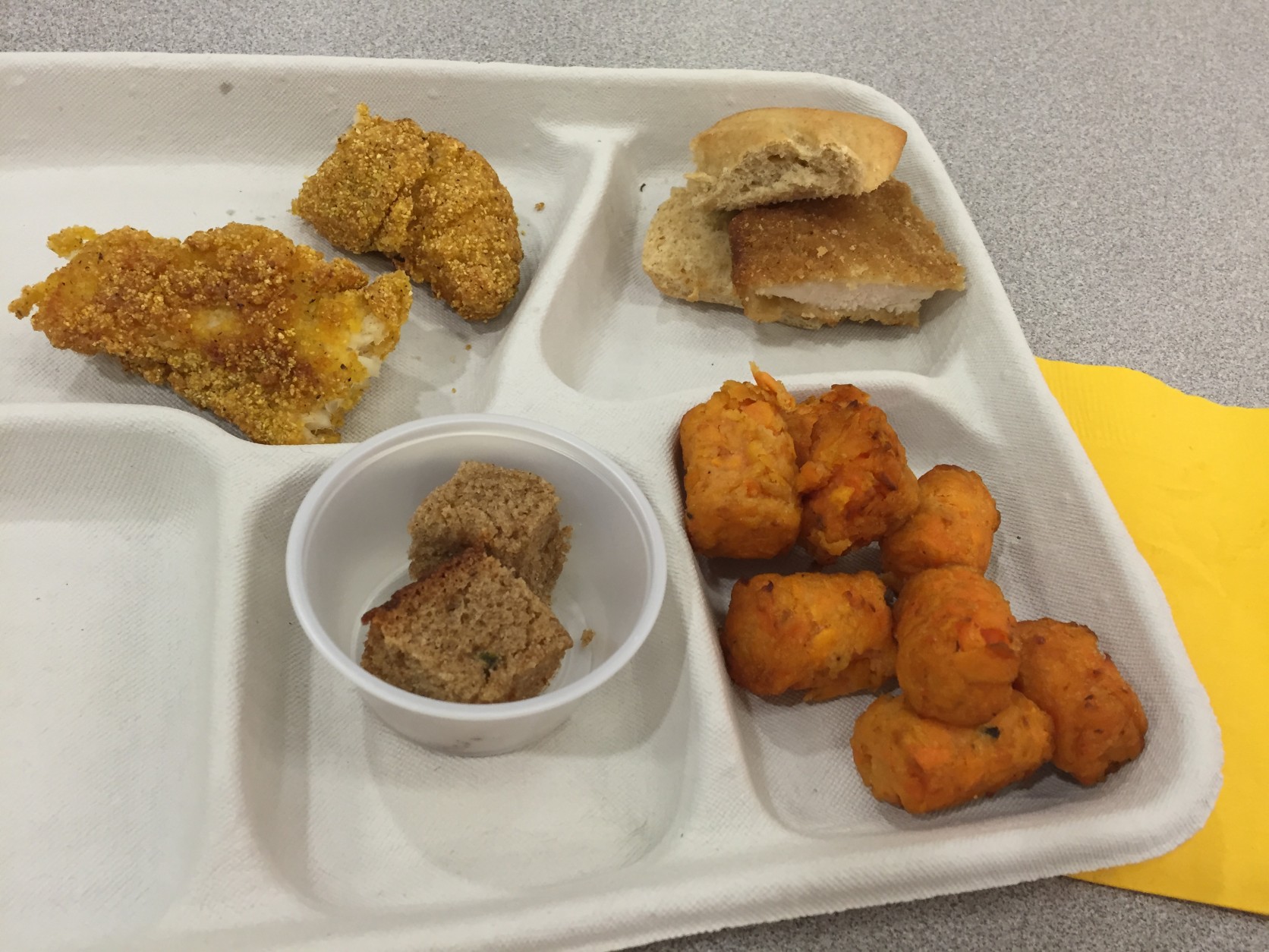 Clockwise from upper left: catfish, a chicken sandwich, sweet potato tots and banana bread. (WTOP/Michelle Basch)