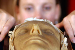 Victoria Crake, employee of auctioneers  Lyon and Turnbull, looks at the Death Mask of Mary Queen of Scots, that is on show at the auctioneers in Edinburgh,  Tuesday Aug. 1,  2006. Members of the public will be able to view the mask at the free  Edinburgh Fringe Festival exhibition which begins on August 6. (AP Photo/ Danny Lawson / PA)  **  UNITED KINGDOM OUT NO SALES NO ARCHIVE  **