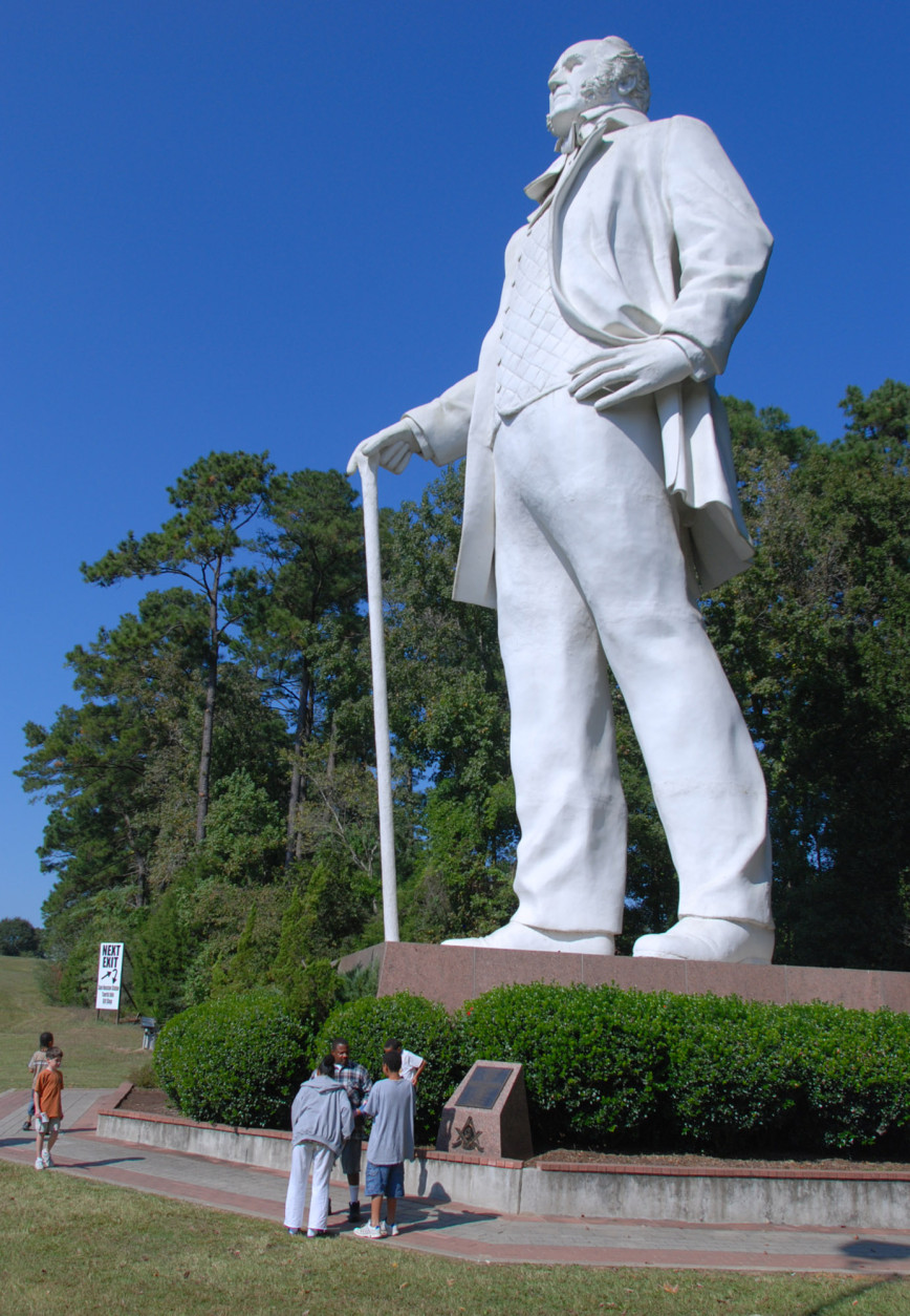 **ADVANCE FOR WEEKEND NOV. 10-11** FILE**Visitors walk beneath the massive figure of Sam Houston on Interstate 45 near Huntsville, Texas Thursday,  Nov. 1, 2007. The Texas Ranger Hall of Fame located on Interstate 35 in Waco Texas is also considering a concrete colossus of a ranger outside its museum. (AP Photo/Waco Tribune Herald, J.B. Smith)
