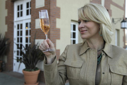 In this photo taken Friday, Dec. 9, 2011, wine author and commentator Leslie Sbrocco looks over a glass of sparkling rose at the Domaine Carneros winery that was founded by Champagne Taittinger in Napa, Calif.  (AP Photo/Eric Risberg)
