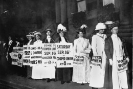 A line of women rally for women's suffrage and advertise a free rally discussing women's right to vote in Washington D.C. on Oct. 3, 1915.  (AP Photo)