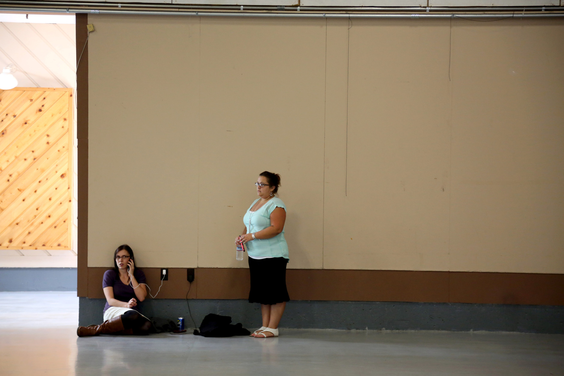 Friends and family wait for students at the local fairgrounds after a deadly shooting at Umpqua Community College, in Roseburg, Ore., Thursday, Oct. 1, 2015. (AP Photo/Ryan Kang)