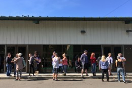 People wait for information at the local fairgrounds after a deadly shooting at Umpqua Community College, in Roseburg, Ore., Thursday, Oct. 1, 2015.  (AP Photo/Ryan Kang)