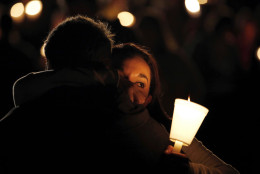 Umpqua Community College student Nichole Zamarripa, right, is consoled during a candle light vigil for those killed during a fatal shooting at the school, Thursday, Oct. 1, 2015, in Roseburg, Ore. (AP Photo/Rich Pedroncelli)