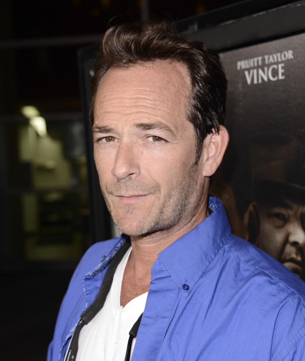 Actor Luke Perry arrives on the red carpet at the premiere of the feature film "Dark Tourist" at the ArcLight Cinemas on Wednesday, August 14, 2013 in Los Angeles. (Photo by Dan Steinberg/Invision/AP)