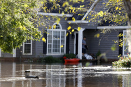 A mailbox is barely visible in the Ashborough subdivision near Summerville, S.C., Tuesday, Oct. 6, 2015. Residents are concerned that the Ashley river will continue to rise as floodwaters come down from Columbia.  (AP Photo/Mic Smith)