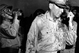 Gen. Douglas MacArthur is seen on Leyte Island in the Philippines, October 20, 1944, during World War II.  He broadcasts to the residents "I have returned."  He also called on them to aid the American invasion forces. Standing to his left is Philippine President Sergio Osmena. (AP Photo)HC00408