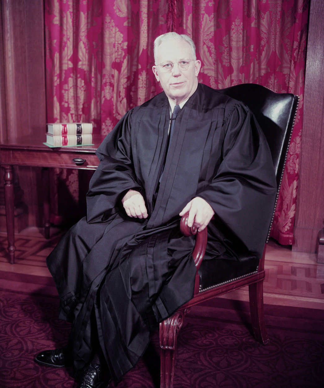 Chief Justice of the United States Supreme Court Earl Warren poses for a formal portrait in December 1953.  (AP Photo)