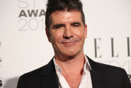 Simon Cowell poses  for photographers at the Elle Style Awards in London, Tuesday, Feb. 24, 2015. (Photo by Joel Ryan/Invision/AP)