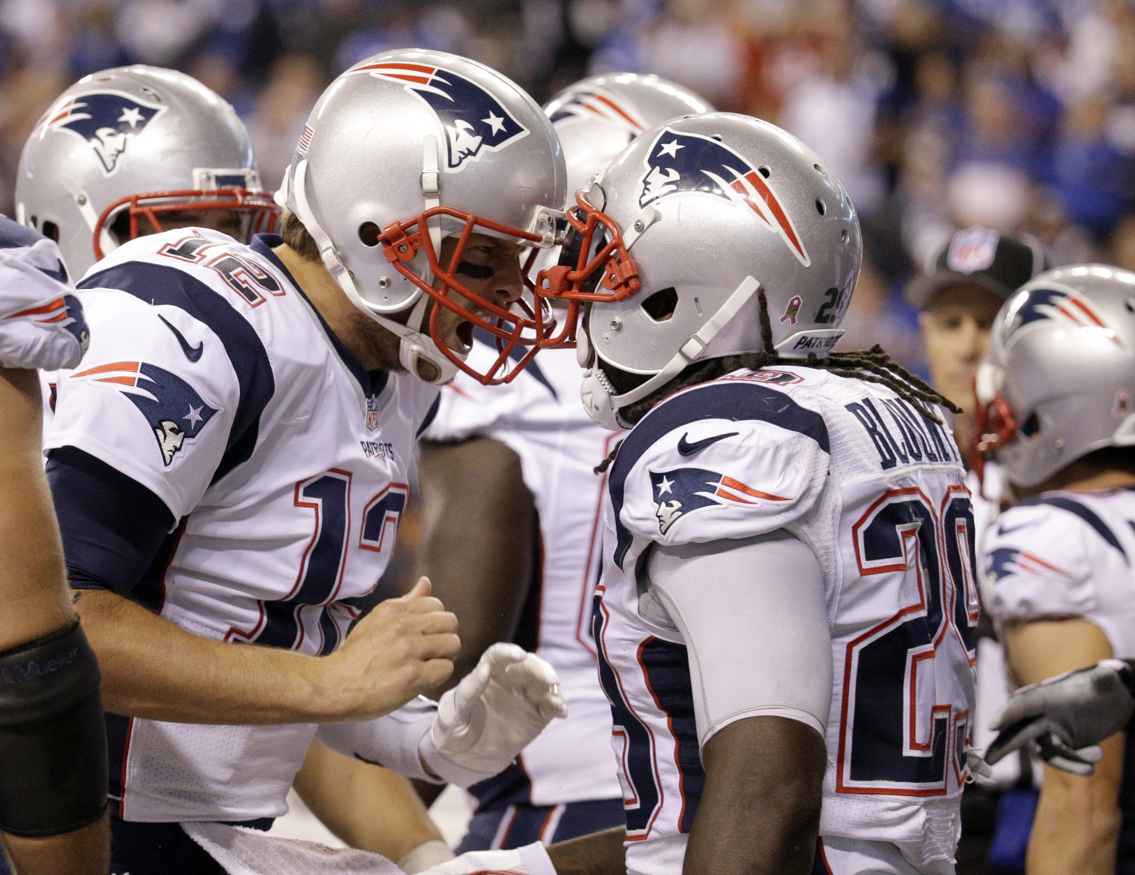New England Patriots running back LeGarrette Blount (29) celebrates a touchdown with quarterback Tom Brady (12) in the second half of an NFL football game against the Indianapolis Colts in Indianapolis, Sunday, Oct. 18, 2015. (AP Photo/John Minchillo)