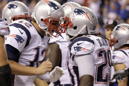 New England Patriots running back LeGarrette Blount (29) celebrates a touchdown with quarterback Tom Brady (12) in the second half of an NFL football game against the Indianapolis Colts in Indianapolis, Sunday, Oct. 18, 2015. (AP Photo/John Minchillo)