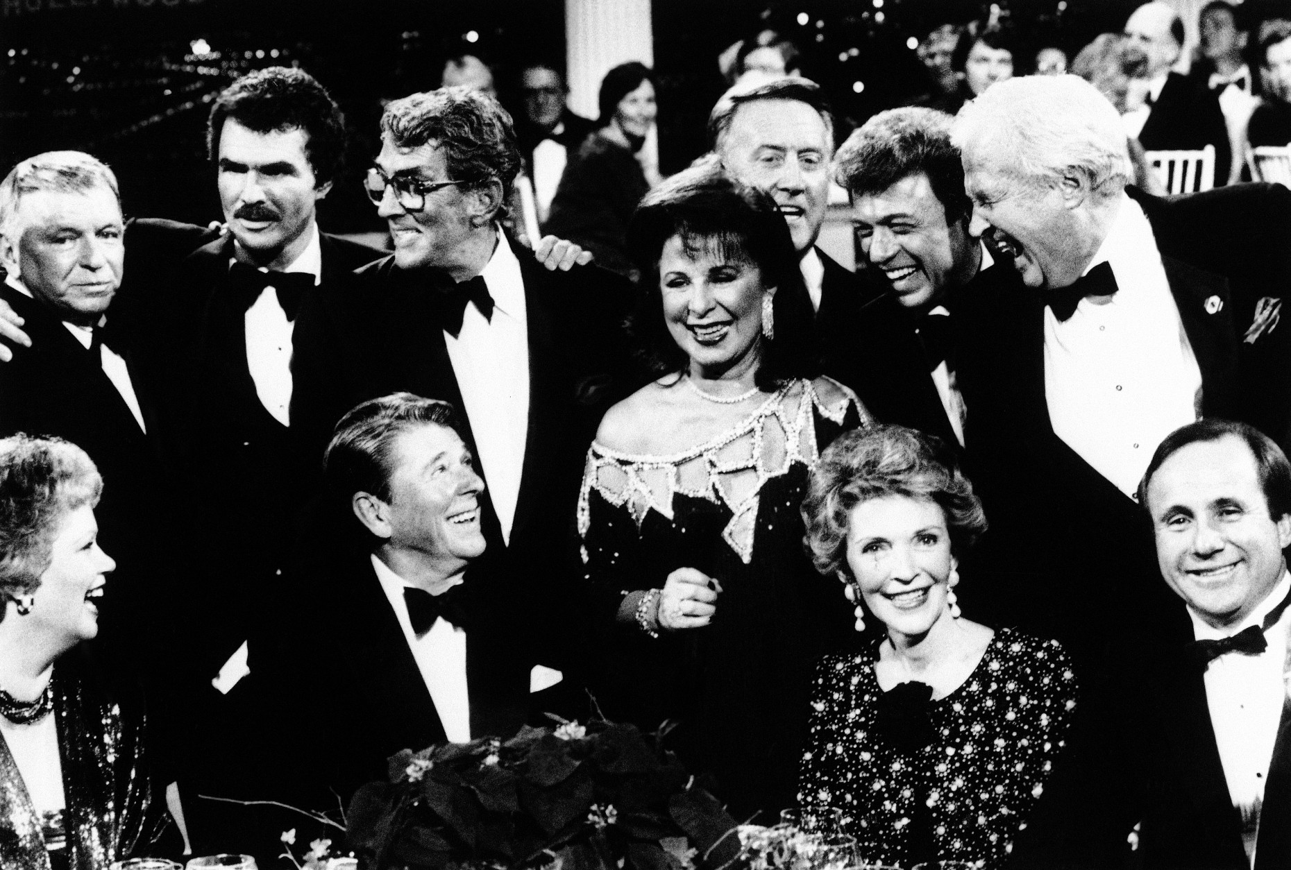 President Ronald Reagan and first lady Nancy Reagan are surrounded by Hollywood friends, Dec. 1, 1985 in Burbank, Calif., after the taping of a CBS-TV special honoring the president titled "All-Star Party For Dutch Reagan". Seated, from left: Maureen Reagan, the president, Mrs. Reagan and Michael Reagan. Standing, from left: Frank Sinatra, Burt Reynolds, Dean Martin, Eydie Gorme, Vin Scully, Steve Lawrence, and Paul Keys. (AP Photo/Scott Stewart)