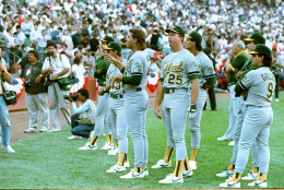 Members of the Oakland Athletics stand and stare as Candlestick Park-goers leave the stadium in the wake of the major earthquake that struck Northern California just before game 3 of the World Series against the San Francisco Giants on Oct. 17, 1989.   (AP Photo)