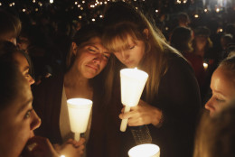 Kristen Sterner, left, and Carrissa Welding, both students of Umpqua Community College, embrace each other during a candle light vigil for those killed during a fatal shooting at the college, Thursday, Oct. 1, 2015, in Roseburg, Ore. (AP Photo/Rich Pedroncelli)