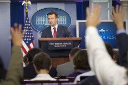 Journalist raises their hands as White House Press secretary Josh Earnest speaks to the media during the daily briefing in the Brady Press Briefing Room of the White House in Washington, Thursday, Oct. 1, 2015. Earnest responded to a report of multiple shootings at Umpqua Community College in central Oregon. (AP Photo/Pablo Martinez Monsivais)