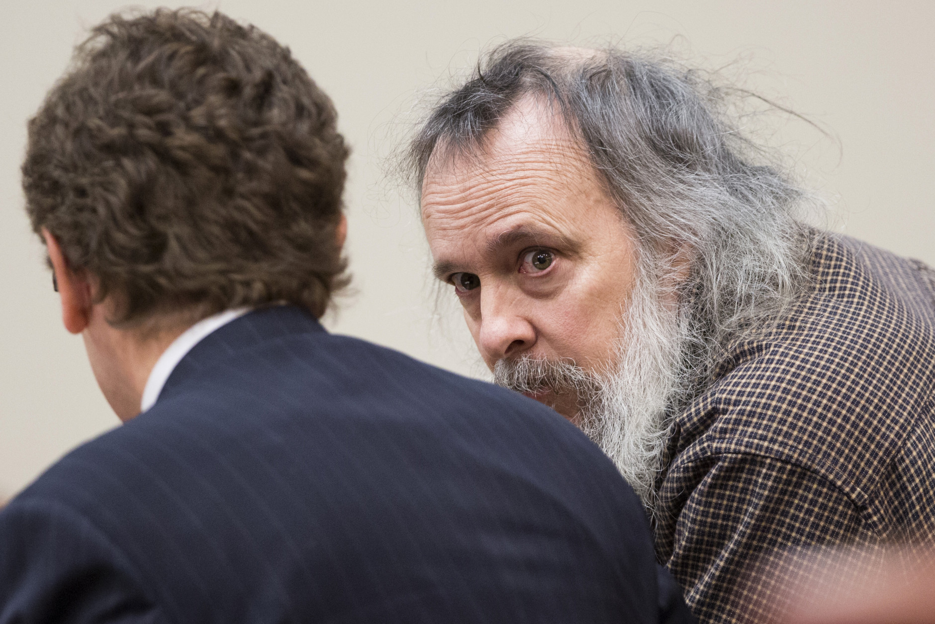 Charles Severance, right, talks with his attorney Joe King during his murder trial at the Fairfax County Circuit Court in Fairfax, Va., Friday, Oct. 16, 2015. Severance is accused of three murders over the course of a decade in Alexandria, Va. (AP Photo/Evan Vucci, Pool)