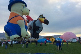 Not all balloons take the traditional shape. There were ones shaped like cows, fire hydrants, Darth Vader's helmet, and these cartoon animal characters. (WTOP/Noah Frank)