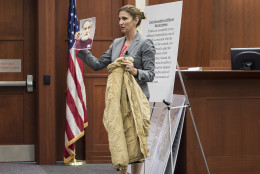 Defense attorney Megan Thomas shows off a carhart jacket belonging to Charles Ross during closing arguments in the trial of trial of Charles Severance at the Fairfax County Circuit Court in Fairfax, Virginia, on Wednesday, October 28, 2015. (Pool Photo by Nikki Kahn/The Washington Post)