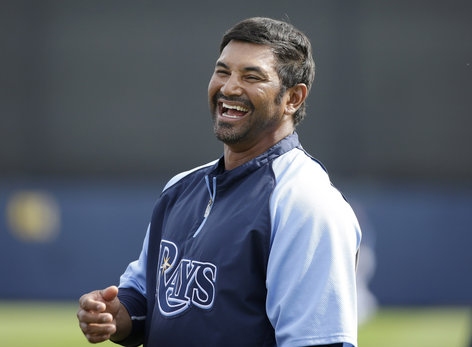 Tampa Bay Rays coach Dave Martinez jokes around before an exhibition baseball game against the New York Yankees, Wednesday, March 5, 2014, in Port Charlotte, Fla. (AP Photo/Steven Senne)