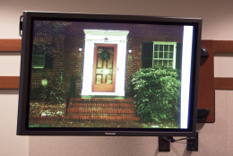 A photograph of the front door to the home of murder victim Nancy Dunning is shown during the trial of Charles Severance at the Fairfax County Circuit Court in Fairfax, Va., Thursday, Oct. 15, 2015.  Severance is accused of three murders over the course of a decade in Alexandria, Va. (AP Photo/Evan Vucci, Pool)