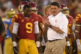 Southern California interim head coach Ed Orgeron, right, cheers on his team as wide receiver Marqise Lee, left, looks on during warmups prior to an NCAA college football game against UCLA, Saturday, Nov. 30, 2013, in Los Angeles. (AP Photo/Mark J. Terrill)