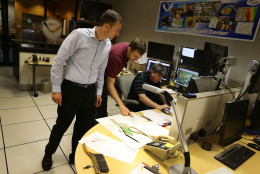 MIAMI, FL - OCTOBER 01:  Jamie Rhome, Storm Surge Specialist, Eric Blake, Hurricane Specialist, and Jack Beven, Senior Hurricane Specialist, (L-R) work in the National Hurricane Center as they track the path of Hurricane Joaquin, a Category 3 storm with maximum sustained winds of 125 mph, as it passes over parts of the Bahamas on October 1, 2015 in Miami, Florida. The forecasters are still trying to determine if the hurricane will turn to the north and northwest, which might affect the U.S. East Coast.  (Photo by Joe Raedle/Getty Images)