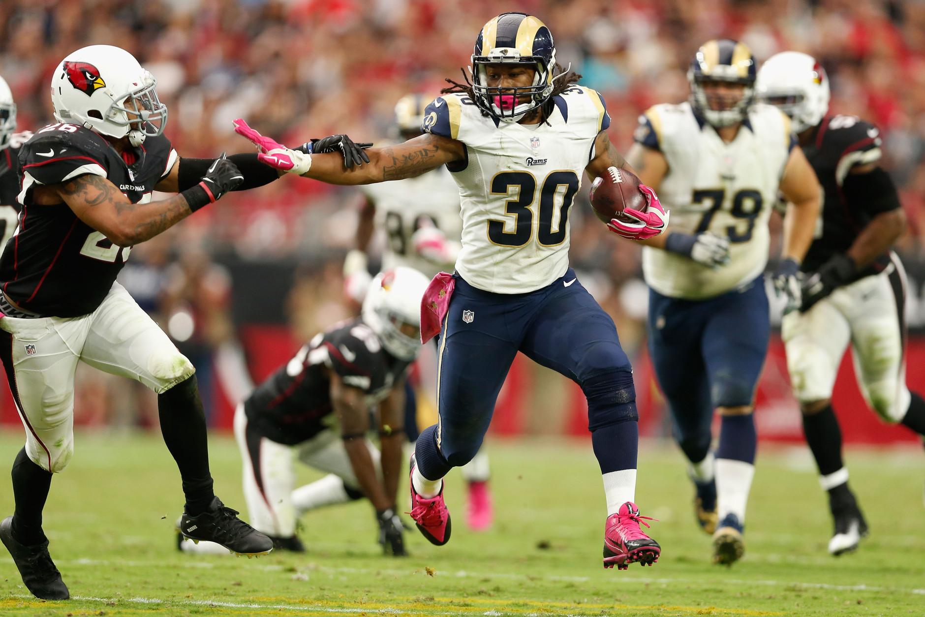 GLENDALE, AZ - OCTOBER 04: Running back Todd Gurley #30 of the St. Louis Rams runs past free safety Rashad Johnson #26 of the Arizona Cardinals during the second half of the NFL game at the University of Phoenix Stadium on October 4, 2015 in Glendale, Arizona.  (Photo by Christian Petersen/Getty Images)