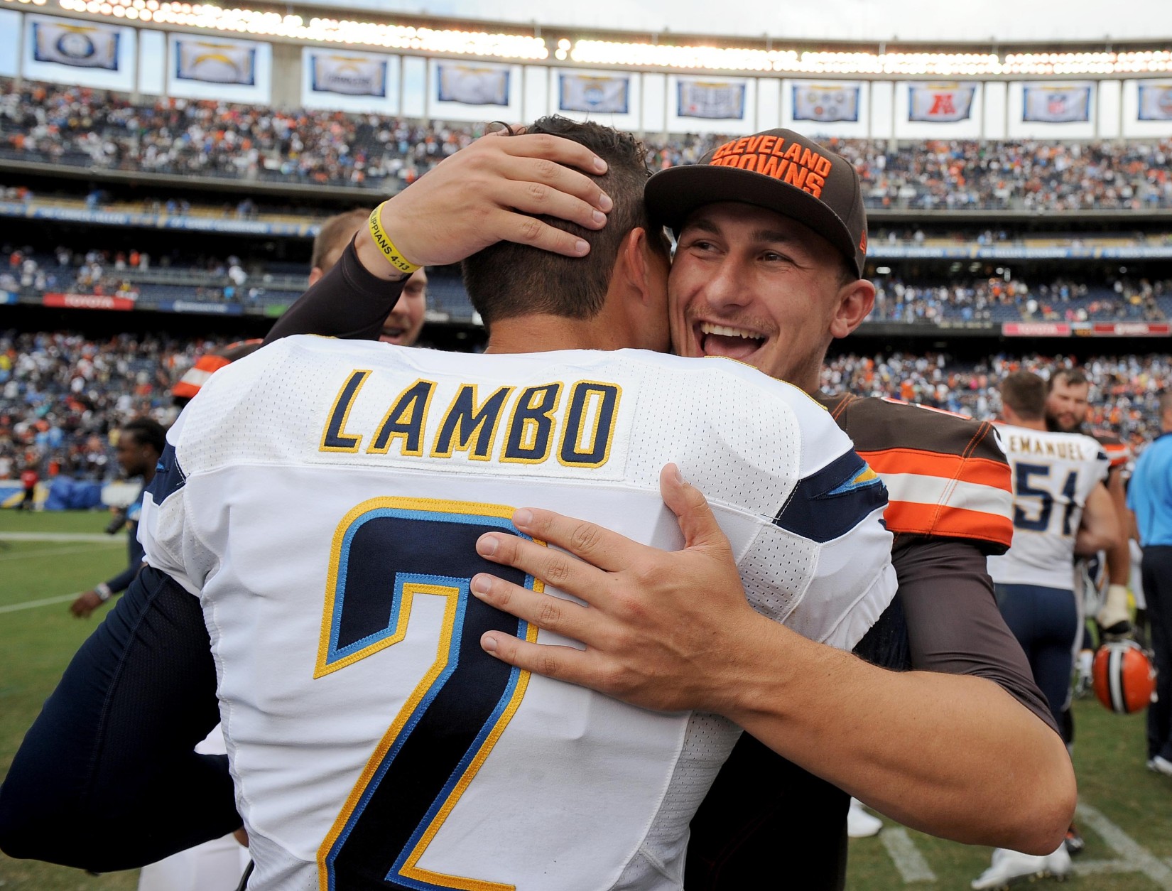 SAN DIEGO, CA- OCTOBER 4:  Johnny Manziel #2 of the Cleveland Browns hugs Josh Lambo #2 of the San Diego Chargers after Lambo kicked game-winning field goal against the Cleveland Browns during their NFL Game on October 4, 2015 in San Diego, California. (Photo by Donald Miralle/Getty Images)