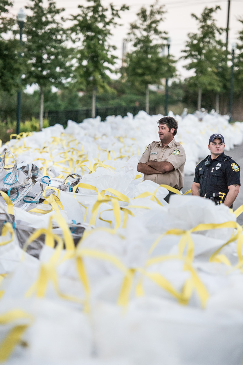 COLUMBIA, SC - OCTOBER 6:  Emergency personnel look out over sandbags at the breach in the Columbia Canal on October 6, 2015 in Columbia, South Carolina. The state of South Carolina experienced record rainfall amounts over the weekend and continues to face resulting flooding. (Photo by Sean Rayford/Getty Images)