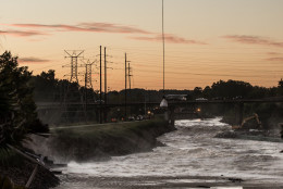 COLUMBIA, SC - OCTOBER 6:  A Chinook helicopter lowers a massive sandbag just up from the breach of the Columbia Canal October 6, 2015 in Columbia, South Carolina. The breach of the canal, caused by recent flooding, has left the City of Columbia without safe drinking water. (Photo by Sean Rayford/Getty Images)