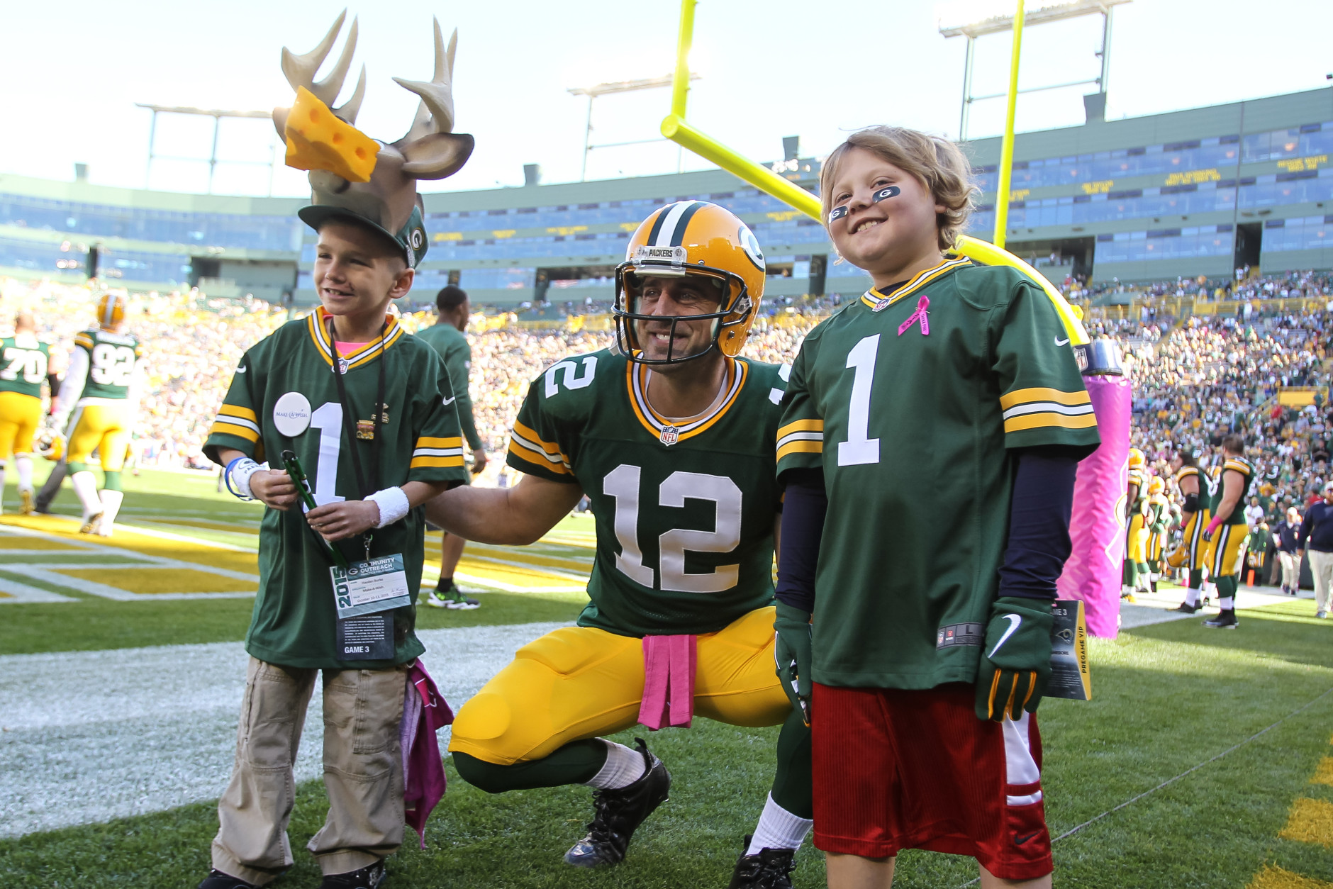 GREEN BAY, WI - OCTOBER 11:  Quarterback Aaron Rodgers #12 of the Green Bay Packers poses with fans prior to the game against the St. Louis Rams at Lambeau Field on October 11, 2015 in Green Bay, Wisconsin.  (Photo by Mike McGinnis/Getty Images)