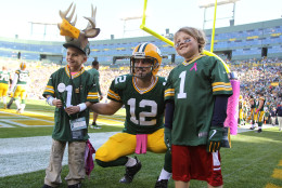 GREEN BAY, WI - OCTOBER 11:  Quarterback Aaron Rodgers #12 of the Green Bay Packers poses with fans prior to the game against the St. Louis Rams at Lambeau Field on October 11, 2015 in Green Bay, Wisconsin.  (Photo by Mike McGinnis/Getty Images)