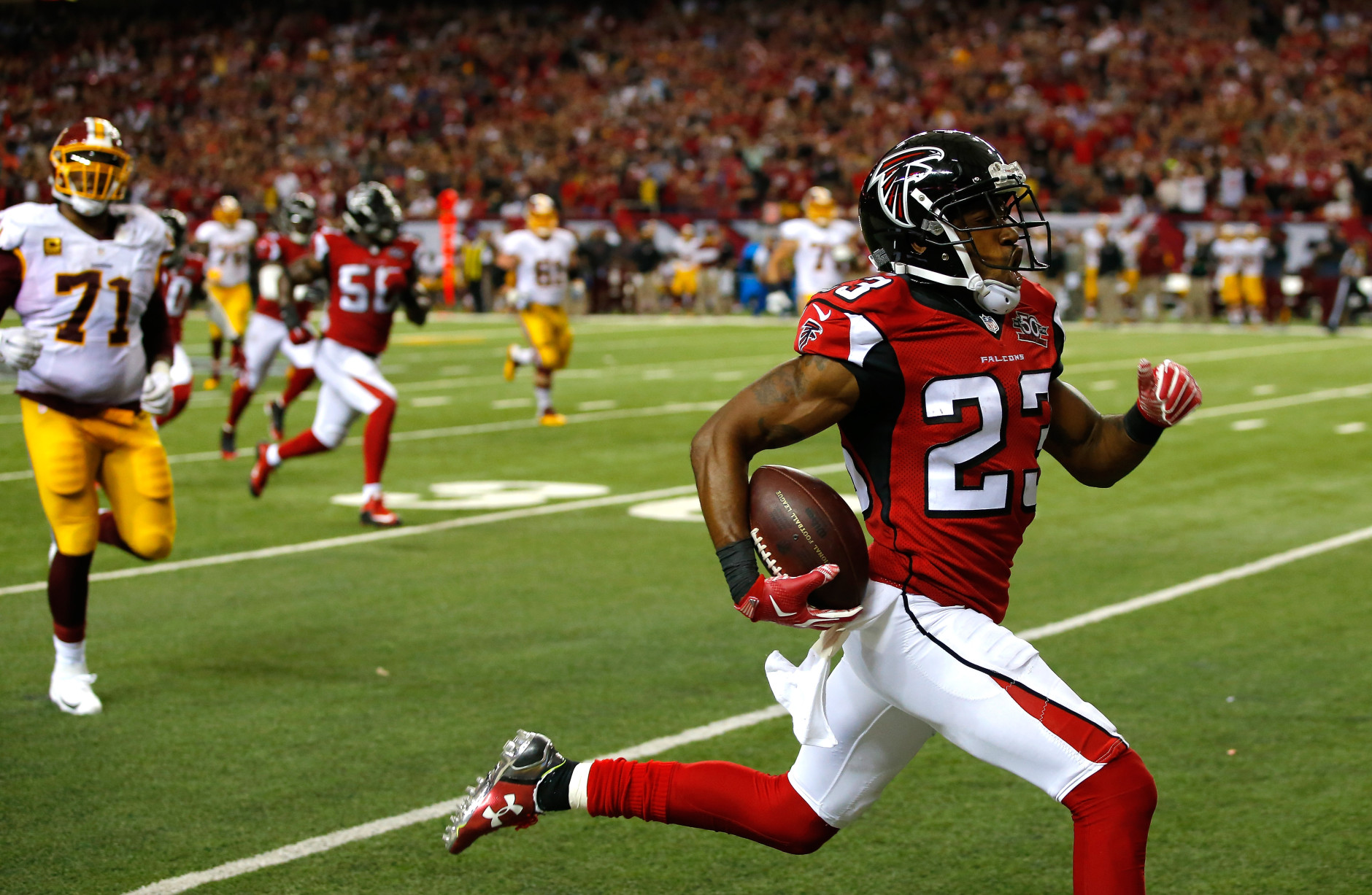 ATLANTA, GA - OCTOBER 11:  Robert Alford #23 of the Atlanta Falcons returns an interception for a touchdown in their 25-19 overtime win against the Washington Redskins at Georgia Dome on October 11, 2015 in Atlanta, Georgia.  (Photo by Kevin C. Cox/Getty Images)