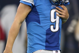DETROIT MI - OCTOBER 11: Matthew Stafford of the Detroit Lions walks off the field holding his shoulder after being sacked by the Arizona Cardinals in the second quarter  on October 11, 2015 at Ford Field in Detroit, Michigan.  (Photo by Leon Halip/Getty Images)