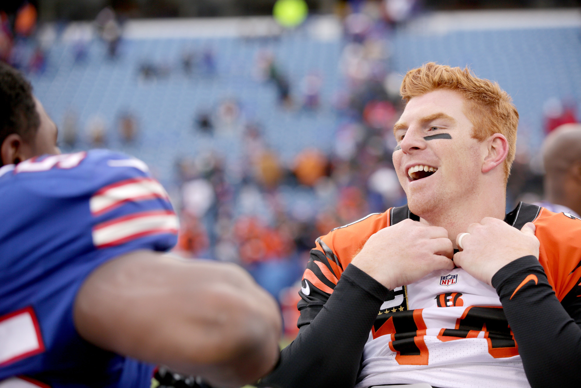 ORCHARD PARK, NY - OCTOBER 18:   Andy Dalton #14 of the Cincinnati Bengals exchanges jerseys with Jerry Hughes #55 of the Buffalo Bills after the game at Ralph Wilson Stadium on October 18, 2015 in Orchard Park, New York.  (Photo by Brett Carlsen/Getty Images)