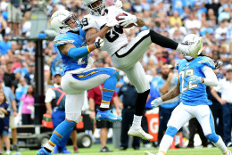SAN DIEGO, CA - OCTOBER 25:  Amari Cooper #89 of the Oakland Raiders makes a catch in front of Jimmy Wilson #27 of the San Diego Chargers during the second quarter at Qualcomm Stadium on October 25, 2015 in San Diego, California.  (Photo by Harry How/Getty Images)