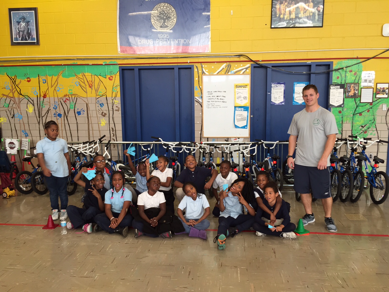 CW Harris Elementary School students pose for a picture with Mr. Richards, the P.E. teacher. (WTOP/Kate Ryan)