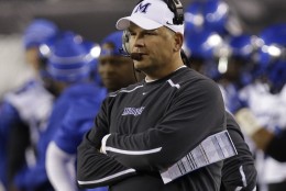 Memphis head coach Justin Fuente watches from the sidelines in the first half of an NCAA college football game against Cincinnati, Saturday, Oct. 4, 2014, in Cincinnati. (AP Photo/Al Behrman)