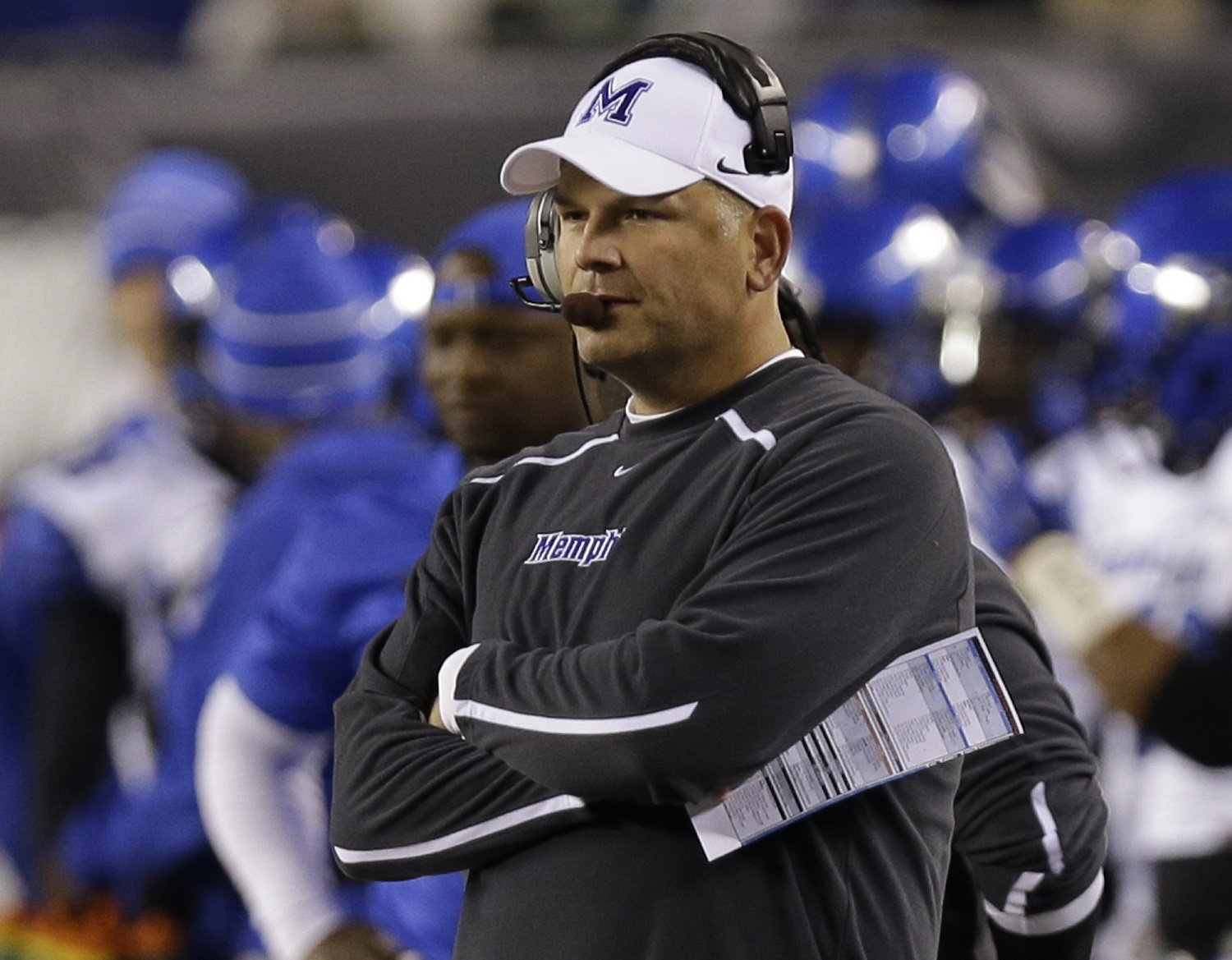 Memphis head coach Justin Fuente watches from the sidelines in the first half of an NCAA college football game against Cincinnati, Saturday, Oct. 4, 2014, in Cincinnati. (AP Photo/Al Behrman)
